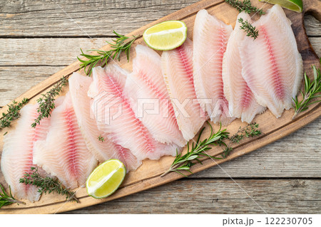 Raw tilapia fillet photography . Top view 122230705