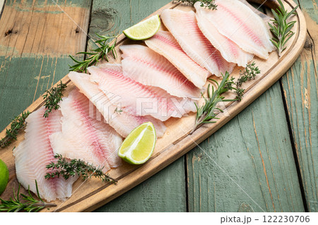 Raw tilapia fillet photography . Top view 122230706