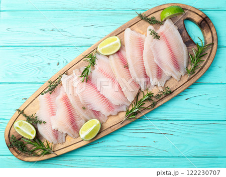 Raw tilapia fillet photography . Top view 122230707
