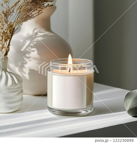 Clear glass jar candle mockup, scented candle jar with blank white label, styled interior candle design template 122230899
