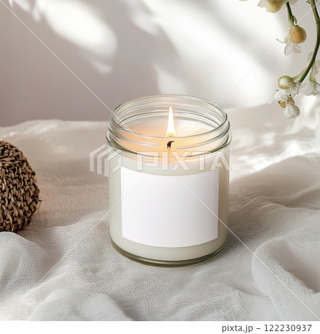 Clear glass jar candle mockup, scented candle jar with blank white label, styled interior candle design template Clear glass jar candle mockup, scented candle jar with blank white label, styled interior candle design template 122230937