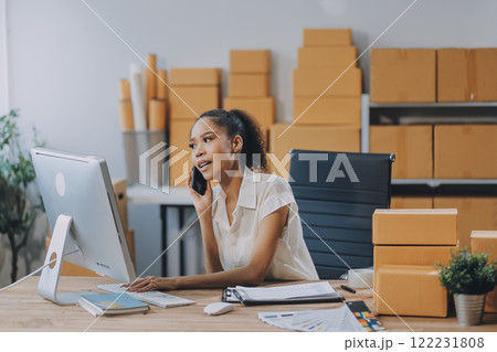 Portrait of Starting small businesses SME owners female entrepreneurs working on receipt box and check online orders to prepare to pack the boxes, sell to customers, SME business ideas online. 122231808