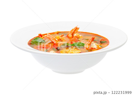 Closeup plate of traditional thai soup - tom yum kung isolated at white background. 122231999