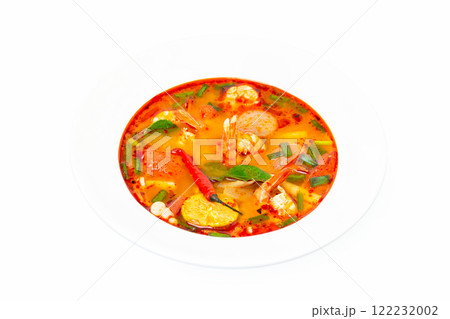 Closeup plate of traditional thai soup - tom yum kung isolated at white background. Closeup plate of traditional thai soup - tom yum kung isolated at white background. 122232002