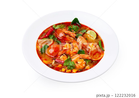 Closeup plate of traditional thai soup - tom yum kung with shrimps and tomatoes isolated at white background. Closeup plate of traditional thai soup - tom yum kung with shrimps and tomatoes isolated at white background. 122232016