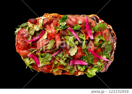Top view image of italian Rome pizza with caramel plum and beef meat isolated at black background. 122232058