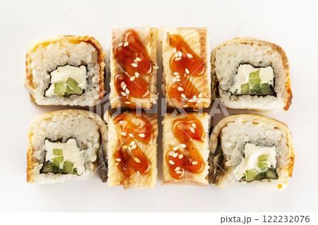 Closeup top view japanese unagi maki sushi set with eel isolated at white background. Closeup top view japanese unagi maki sushi set with eel isolated at white background. 122232076