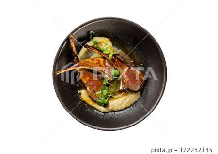 Pan of grilled lamb served with mashed potatoes isolated at white background. 122232135
