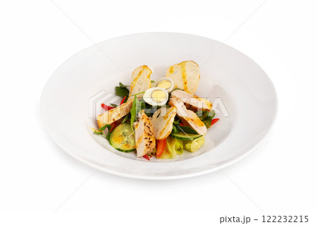 Plate of healthy caesar salad with grilled chicken breast, eggs, croutons, tomato and vegetables isolated at white background. 122232215