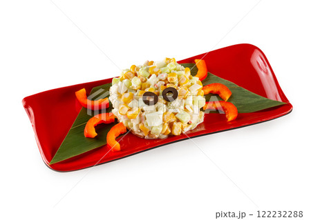 Closeup plate of crab salad with corn and eggs served as a funny crab for children menu isolated at white background. Closeup plate of crab salad with corn and eggs served as a funny crab for children menu isolated at white background. 122232288