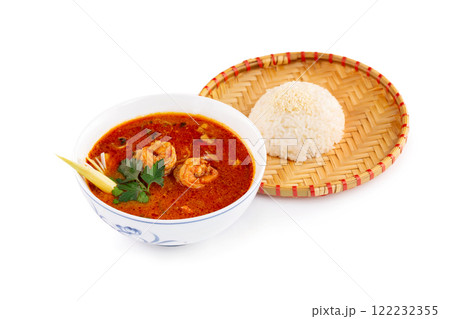 Bowl of traditional vietnamese soup tom yum with prawns and seafood served with plate of steamed rice isolated at white background. 122232355