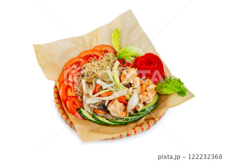 Wicker plate of traditional vietnamese dish - egg noodles with seafood, shrimps and vegetables isolated at white background. Wicker plate of traditional vietnamese dish - egg noodles with seafood, shrimps and vegetables isolated at white background. 122232368
