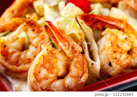 Macro image of grilled prawns with spices and sauce. 122232665