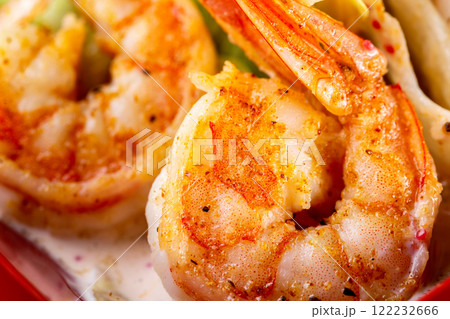 Macro image of grilled prawns with spices and sauce. Macro image of grilled prawns with spices and sauce. 122232666