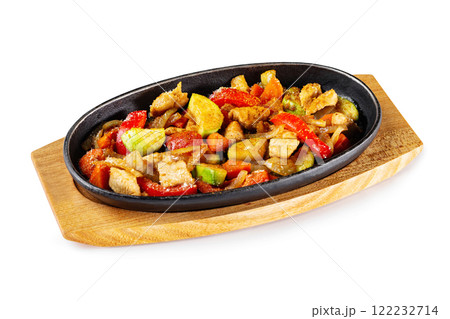 Pan of fried chicken with pineapple and grilled vegetables at wooden board isolated at white background. Pan of fried chicken with pineapple and grilled vegetables at wooden board isolated at white background. 122232714