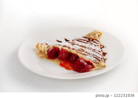 Image of fresh fried pancake plate decorated with sweet strawberry and sugar powder isolated on white background. Image of fresh fried pancake plate decorated with sweet strawberry and sugar powder isolated on white background. 122232836