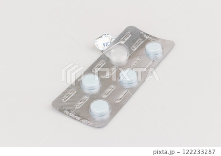 Used pill blister pack isolated on white background Used pill blister pack isolated on white background 122233287