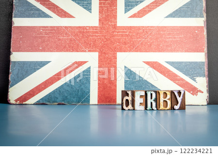 DERBY. Urban Area in Great Britain. Flag and alphabet letters on wooden texture background DERBY. Urban Area in Great Britain. Flag and alphabet letters on wooden texture background 122234221