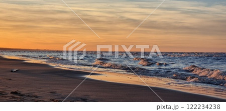 Beautiful sunset on the beach of the Gulf of Baltics. 122234238