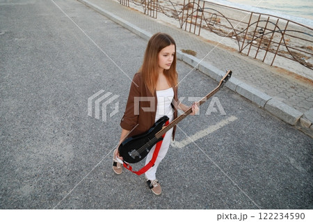 Girl Plays The Bass Instrument Music In The Street Girl Plays The Bass Instrument Music In The Street 122234590