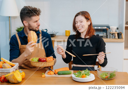 Couple Prepares Healthy Meals with Fresh Vegetables and Fruits. Couple Prepares Healthy Meals with Fresh Vegetables and Fruits. 122235094