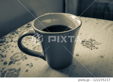 Red cup of coffee on grandmas table. Angra dos Reis. Red cup of coffee on grandmas table. Angra dos Reis. 122235217