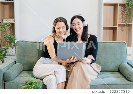Remote Learning. Motivated Two Women Studying Online with Headphones. Remote Learning. Motivated Two Women Studying Online with Headphones. 122235519