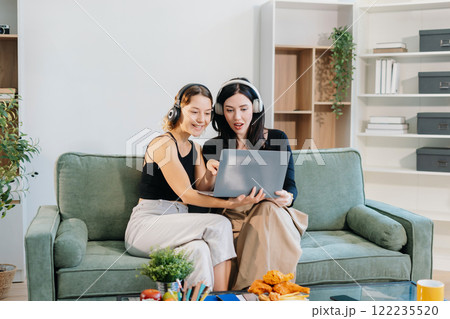 Remote Learning. Motivated Two Women Studying Online with Headphones. Remote Learning. Motivated Two Women Studying Online with Headphones. 122235520