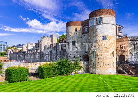London, England. The Tower of London by the river Thames, United Kingdom capital spotlight. 122235873