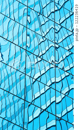 Dynamic Glass Reflections. An Abstract Play of Light and Shapes, Ideal for Modern Design Concepts, Architectural Presentations, or Visual Branding. 122236419