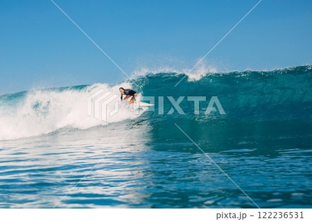 Surfer woman fell off a ocean wave. Surfgirl wipe out during surfing 122236531