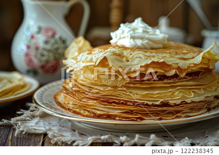 Delicious Stack of Homemade Pancakes with Whipped Cream in Rustic Kitchen Setting 122238345