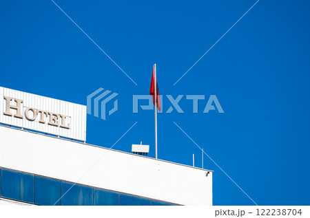 The Intercontinental hotel with Albanian flag at the Skanderbeg square, Tirana, Albania The Intercontinental hotel with Albanian flag at the Skanderbeg square, Tirana, Albania 122238704