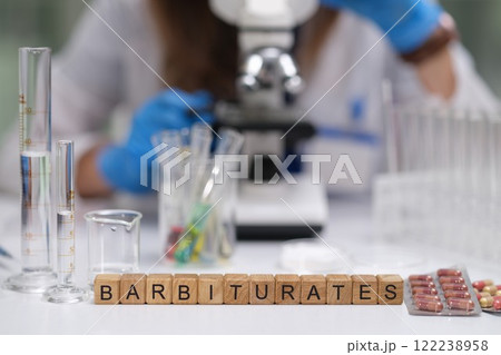 A detailed Laboratory Scene showcasing Barbiturates and a Microscope for scientific analysis A detailed Laboratory Scene showcasing Barbiturates and a Microscope for scientific analysis 122238958