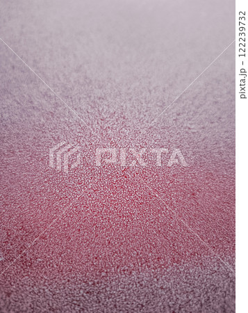 Frozen red surface covered with sparkling ice crystals in winter 122239732