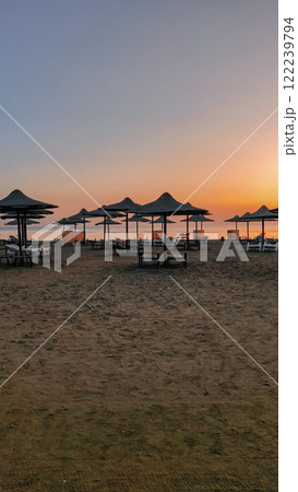 Sunrise painting the sky over empty beach in marsa alam, egypt 122239794