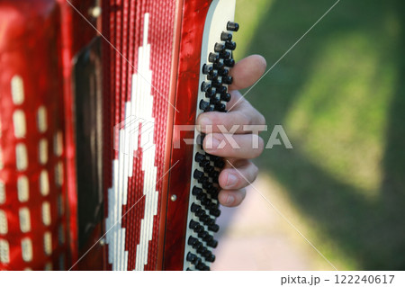 Hands Of A Professional Player On The Accordion Buttons Hands Of A Professional Player On The Accordion Buttons 122240617