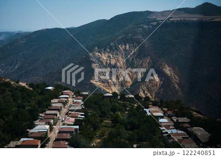 a view of the mountain road, city and mountains from the funicular near Tatev Monastery a view of the mountain road, city and mountains from the funicular near Tatev Monastery 122240851