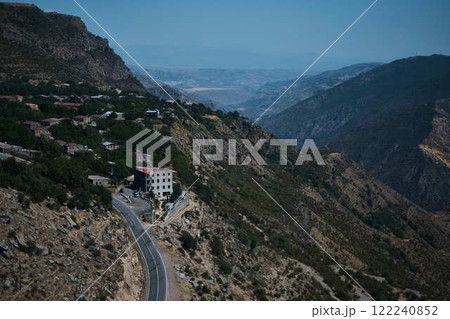 a view of the mountain road, city and mountains from the funicular near Tatev Monastery 122240852