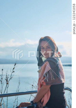 a young woman in scarf Sevanavank, monastery on lake Sevan, armenia 122241058