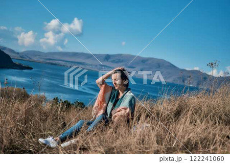 a young woman in scarf Sevanavank, monastery on lake Sevan, armenia 122241060