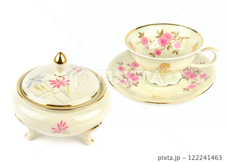 Vintage porcelain tableware: coffee cup with saucer and elegant candy bowl isolated on white. Collage. Vintage porcelain tableware: coffee cup with saucer and elegant candy bowl isolated on white. Collage. 122241463