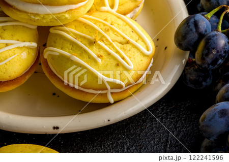 Homemade round lemon cookies. French sweet yellow cookies macarons Homemade round lemon cookies. French sweet yellow cookies macarons 122241596