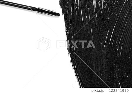 The texture of black mascara and an eyelash brush. Copy space 122241959