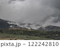 A view of the Andalusian countryside, on a rare weather day. Low clouds drifts over the landscape, with a single Finca visible amounst the Olive groves 122242810