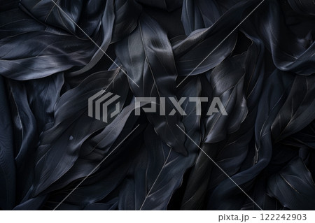 The silk textures of tropical black leaves exude a glossy sheen, reflecting light amidst their intricate patterns, evoking a sense of elegance and exotic allure 122242903
