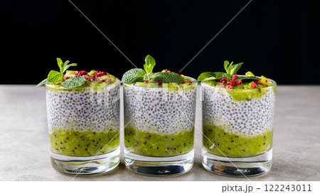 Chia pudding with kiwi. The best healthy vegan dessert with coconut milk and chia seeds. Chia pudding with kiwi. The best healthy vegan dessert with coconut milk and chia seeds. 122243011