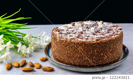 Homemade chocolate cake on the table with almonds. delicious dessert 122243021