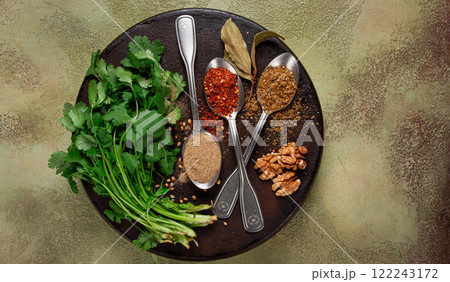 Georgian spices in spoons, on ketsi, top view, no people, 122243172