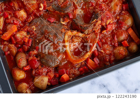 ossobuco stew with vegetables, knuckle on the bone with new potatoes, in tomato sauce,homemade, top view, no people, 122243190